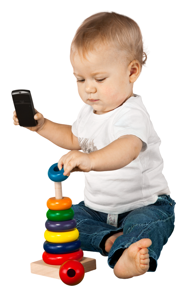 Baby boy holding a mobile phone and playing with a toy